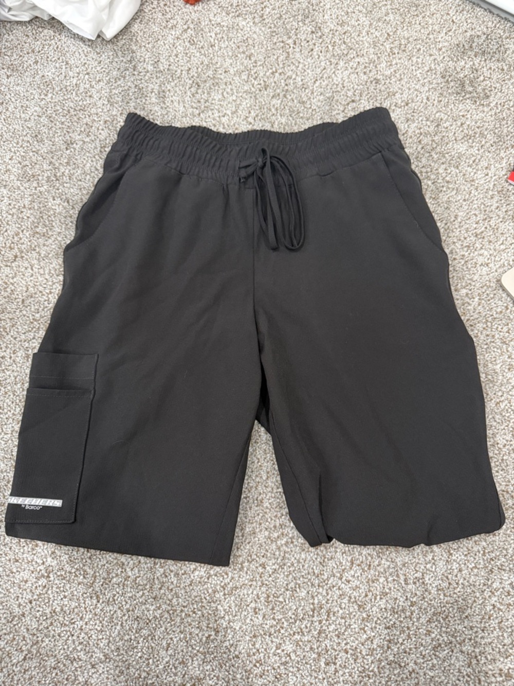 woman’s black scrub pants